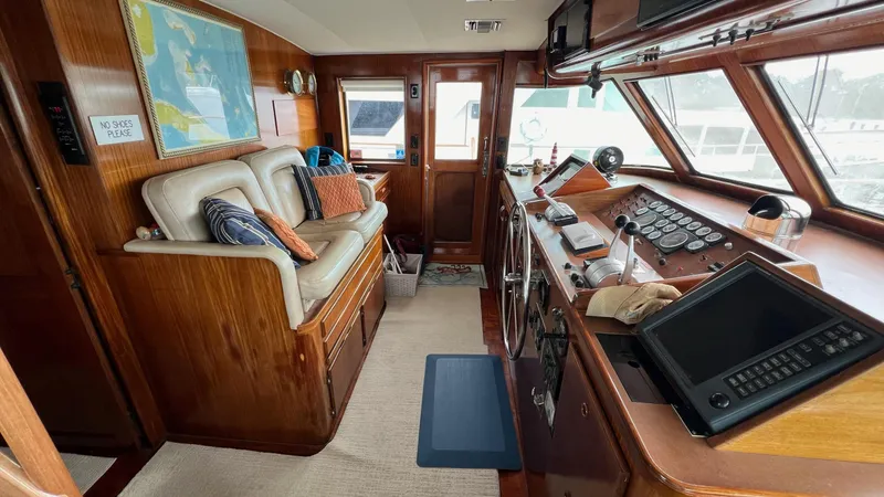 Slide: The Image of 1987 Hatteras Motoryacht interior with helm, seating, and navigation equipment. - 19