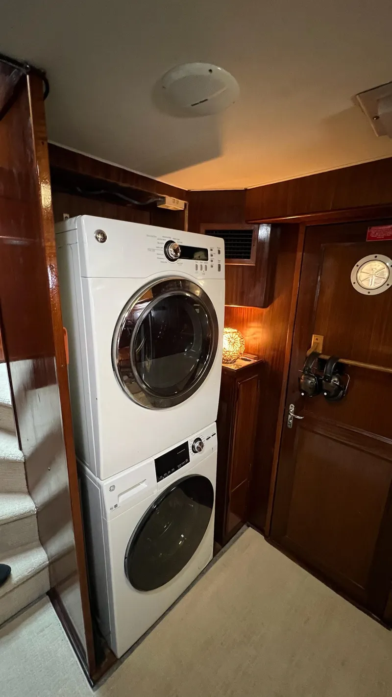 Slide: The Image of Stacked washer and dryer in 1987 Hatteras Motoryacht interior. - 26