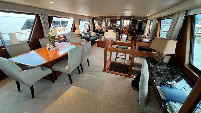 Slide: The Image of Luxurious interior of a 1987 Hatteras Motoryacht with elegant dining and seating areas. - 3