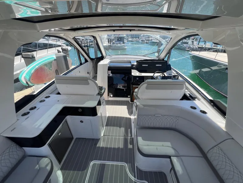 Slide: The Image of Interior of 2023 Sea Ray Sundancer 370 OB luxury yacht with modern seating and helm station. - 13