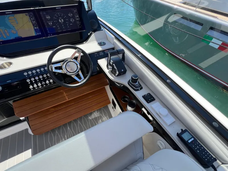Slide: The Image of Cockpit of 2023 Sea Ray Sundancer 370 OB with advanced navigation system. - 16