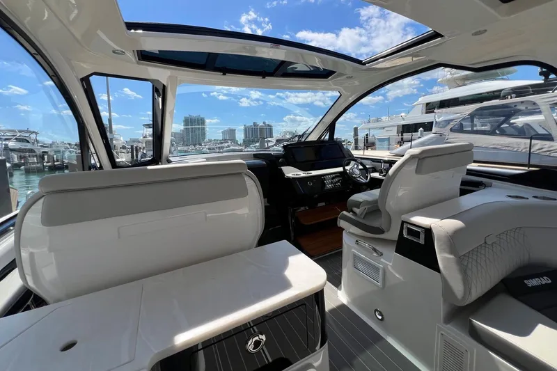 Slide: The Image of 2023 Sea Ray Sundancer 370 OB interior with modern helm and seating. - 21