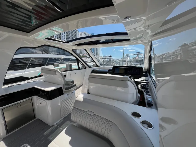 Slide: The Image of Interior of 2023 Sea Ray Sundancer 370 OB luxury yacht with modern helm and seating. - 22