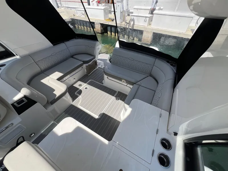 Slide: The Image of 2023 Sea Ray Sundancer 370 OB interior seating area with modern design. - 23
