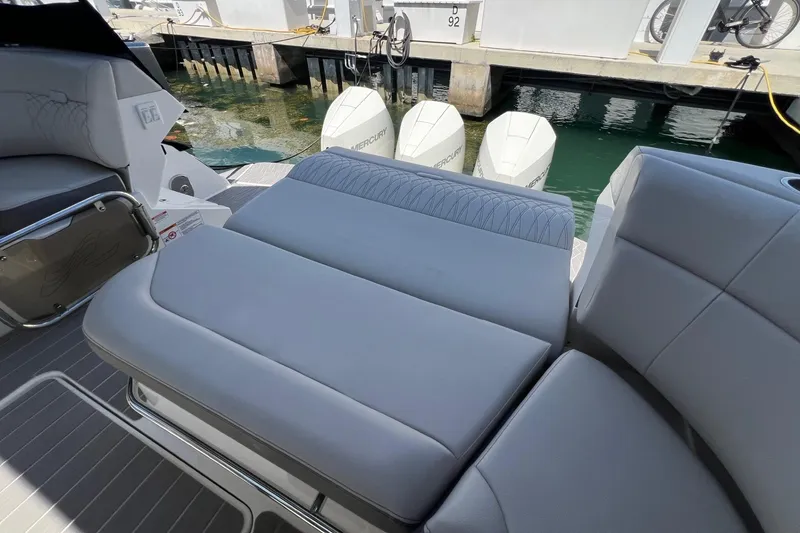Slide: The Image of 2023 Sea Ray Sundancer 370 OB with comfortable seating and triple outboard engines. - 25