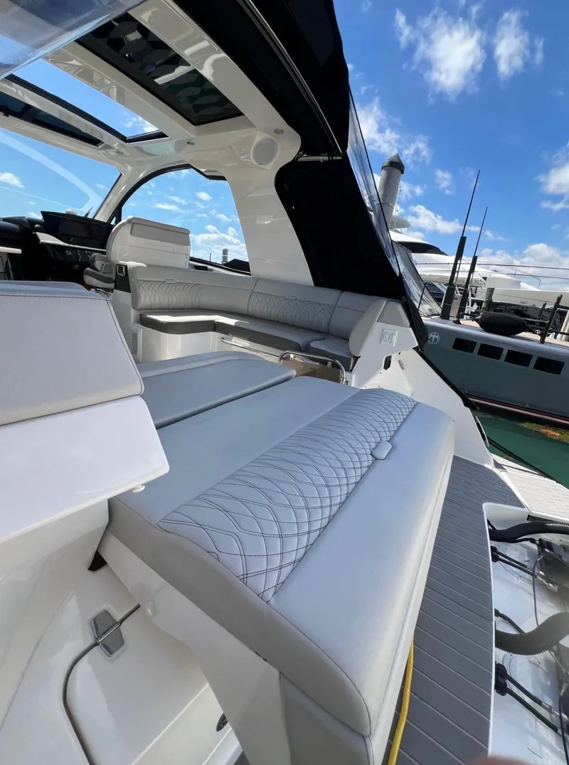 Slide: The Image of 2023 Sea Ray Sundancer 370 OB luxury yacht interior with plush seating. - 26