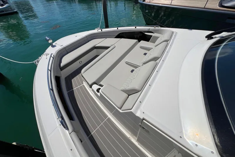 Slide: The Image of 2023 Sea Ray Sundancer 370 OB bow seating area with luxurious cushions. - 29