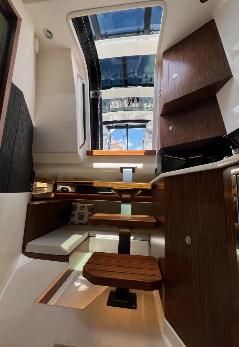 Slide: The Image of Interior of 2023 Sea Ray Sundancer 370 OB yacht with modern wood finishes. - 31