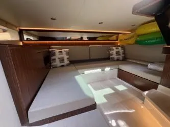 Slide: The Image of Interior cabin of 2023 Sea Ray Sundancer 370 OB with modern seating and cushions. - 33