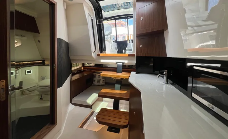 Slide: The Image of Interior of 2023 Sea Ray Sundancer 370 OB yacht with modern kitchen and bathroom. - 34