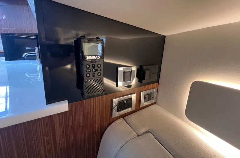 Slide: The Image of Control panel and electronics in 2023 Sea Ray Sundancer 370 OB cabin. - 37