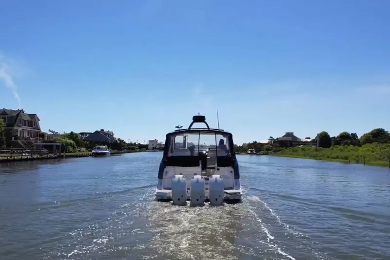 Slide: The Image of 2023 Sea Ray Sundancer 370 OB cruising on a sunny day. - 4