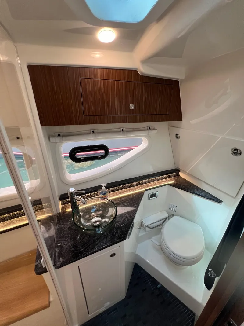 Slide: The Image of 2023 Sea Ray Sundancer 370 OB bathroom with modern fixtures and sleek design. - 42