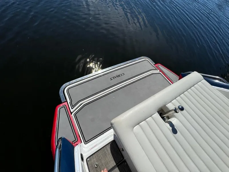 Slide: The Image of 2015 Cobalt A28 boat swim platform on calm water. - 16