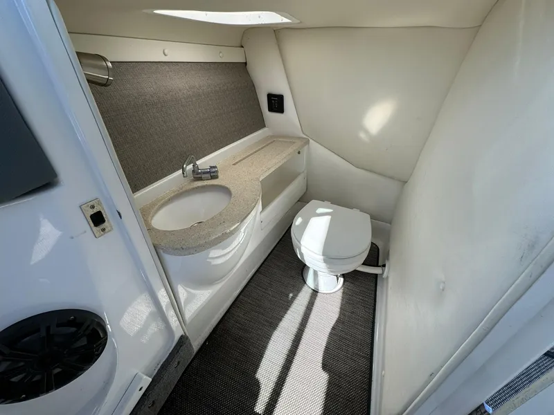 Slide: The Image of 2015 Cobalt A28 boat bathroom with sink and toilet. - 18