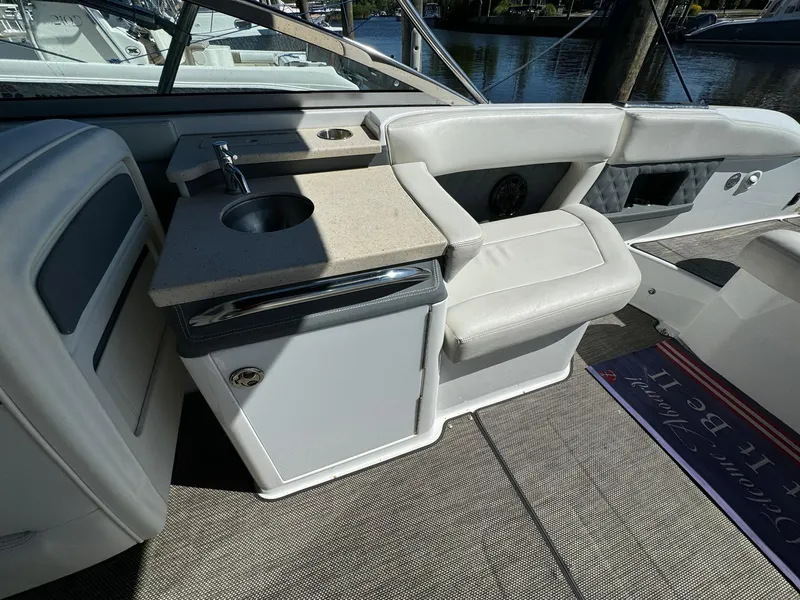 Slide: The Image of 2015 Cobalt A28 boat interior with sink and seating area. - 5