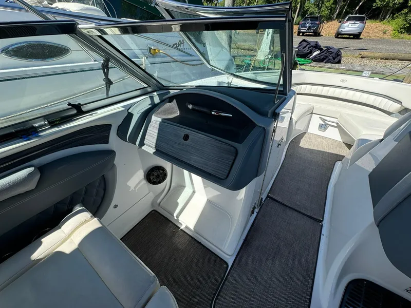 Slide: The Image of 2015 Cobalt A28 boat interior with seating and dashboard. - 8