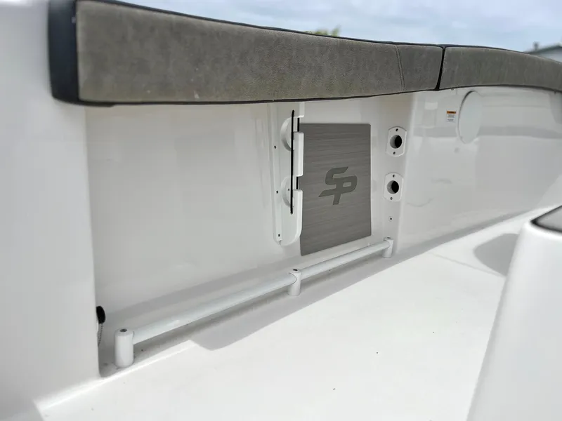 Slide: The Image of 2024 Sea Pro 245 FLX boat interior detail with storage compartment. - 10