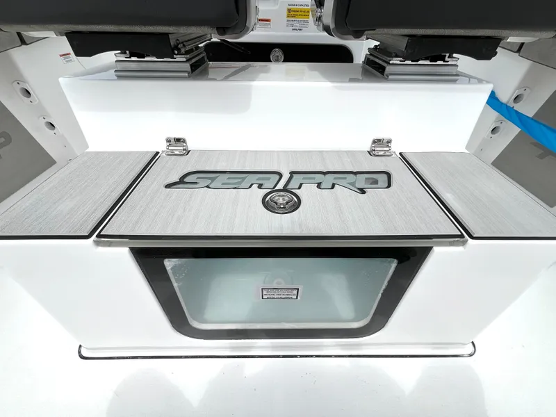 Slide: The Image of 2024 Sea Pro 245 FLX boat interior with storage compartment. - 11