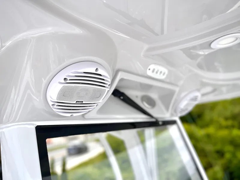 Slide: The Image of 2024 Sea Pro 245 FLX boat interior with built-in speakers. - 18