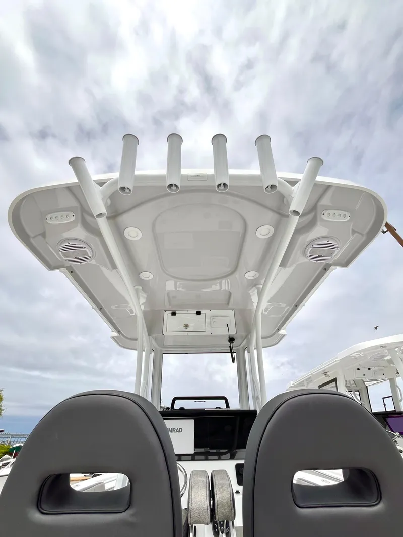 Slide: The Image of 2024 Sea Pro 245 FLX boat with T-top and rod holders. - 22