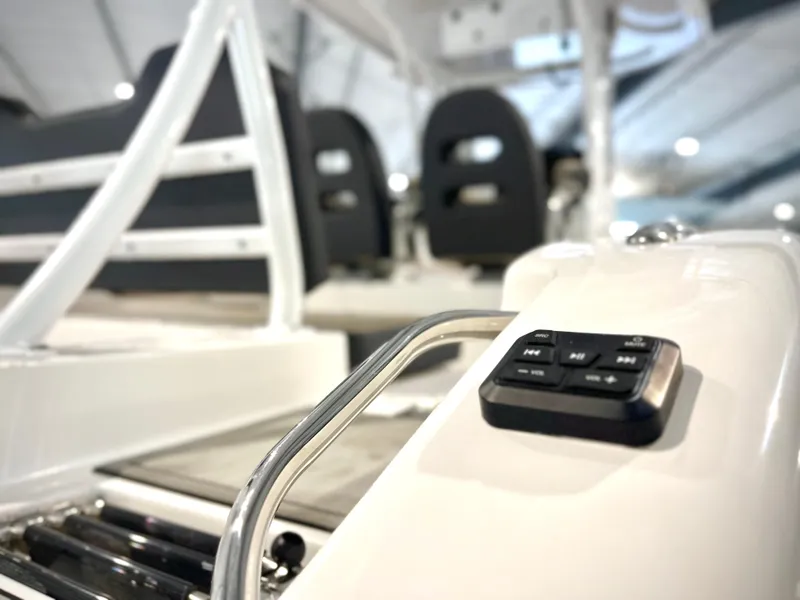 Slide: The Image of 2024 Sea Pro 245 FLX boat interior with control panel and seating. - 7