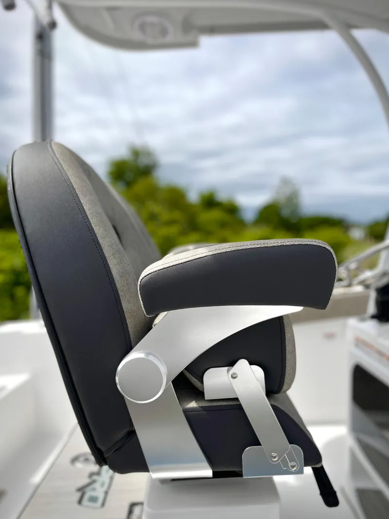 Slide: The Image of 2024 Sea Pro 245 FLX boat seat with armrest and adjustable features. - 9