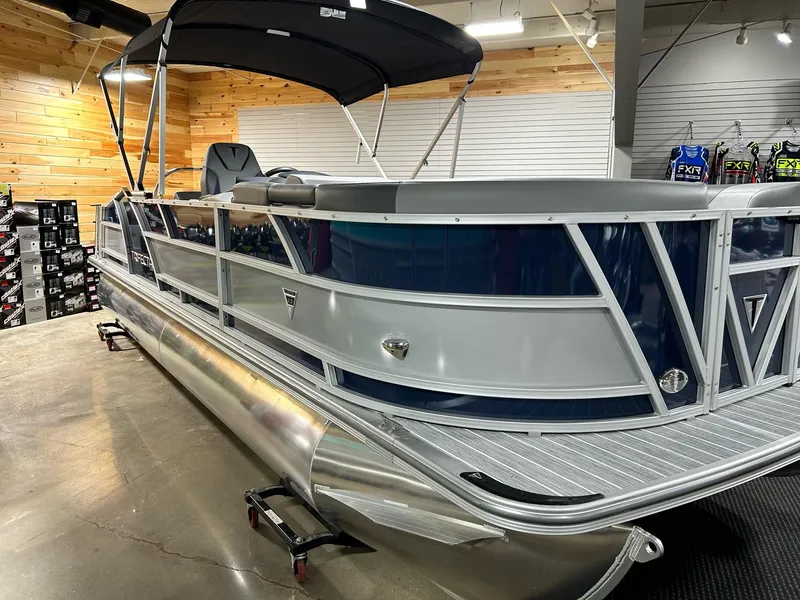 The Image of 2024 Trifecta 23SBESS pontoon boat in showroom, side view. - 1