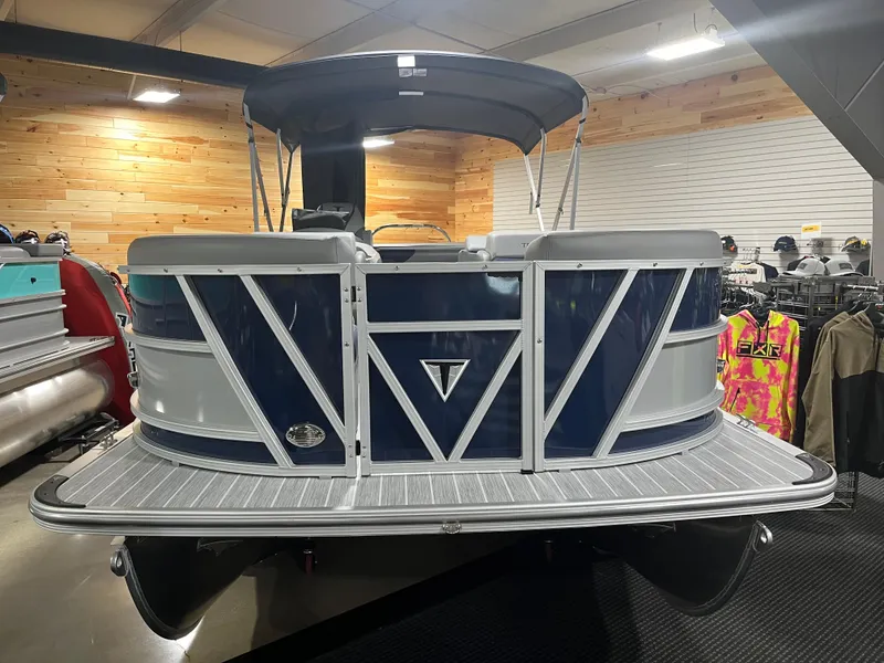 Slide: The Image of 2024 Trifecta 23SBESS pontoon boat in showroom. - 4