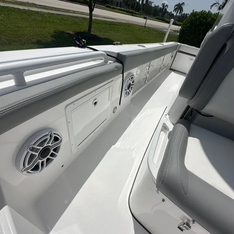 Slide: The Image of 2024 Everglades 235 Center Console boat interior with seating and storage compartments. - 3