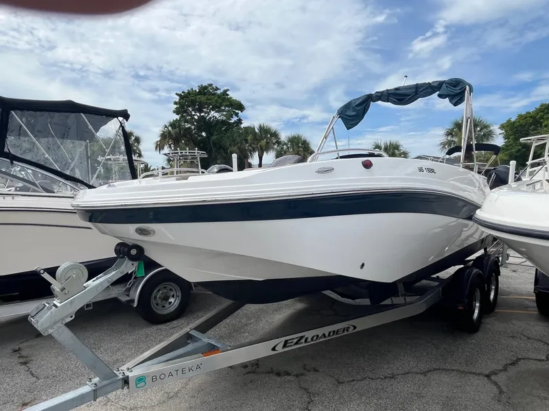 Slide: The Image of 2021 Hurricane SunDeck Sport 192 RL OB boat on trailer, ready for adventure. - 2