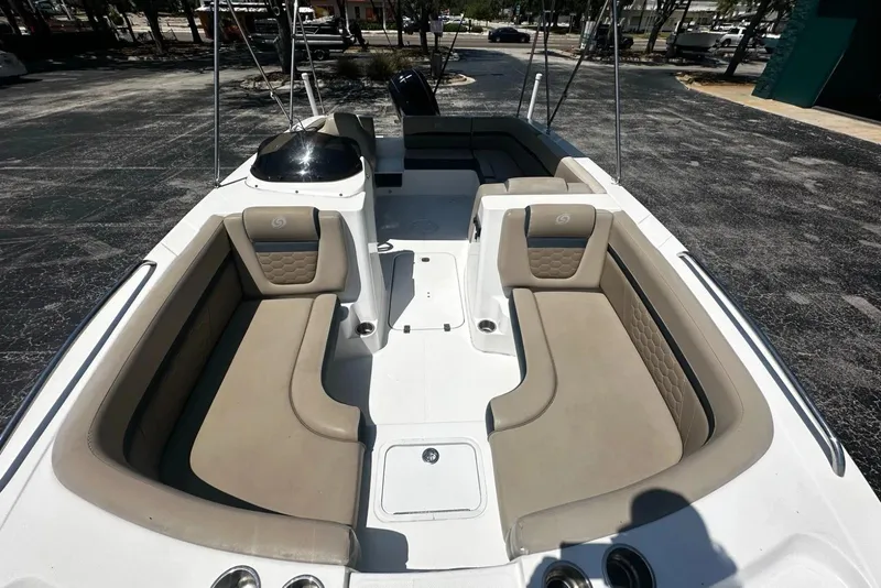 Slide: The Image of 2021 Hurricane SunDeck Sport 192 RL OB boat interior with beige seating and spacious layout. - 7