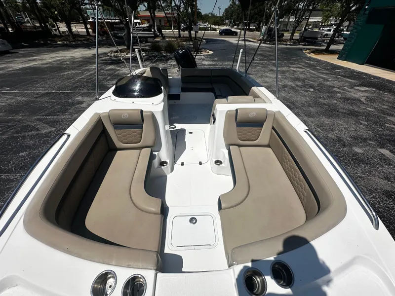 Slide: The Image of 2021 Hurricane SunDeck Sport 192 RL OB boat interior with beige seating and console. - 12