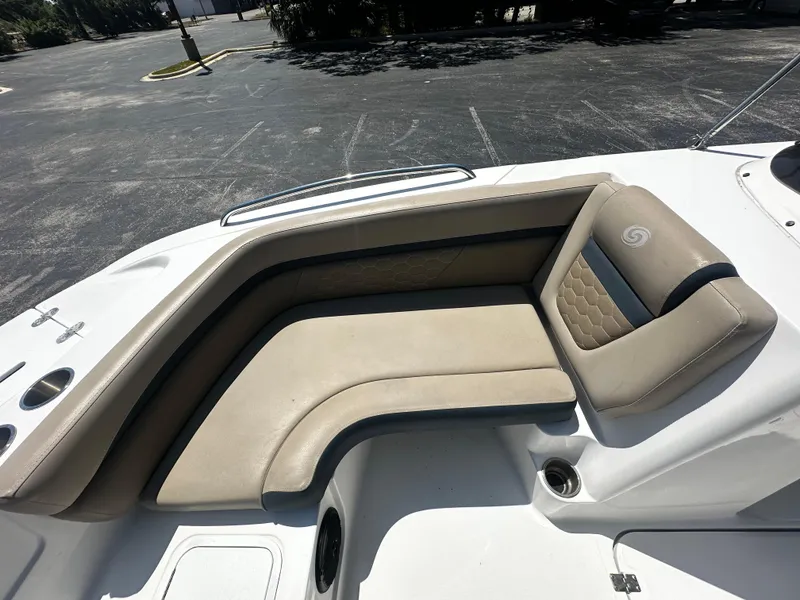 Slide: The Image of 2021 Hurricane SunDeck Sport 192 RL OB boat with beige seating in a parking lot. - 6