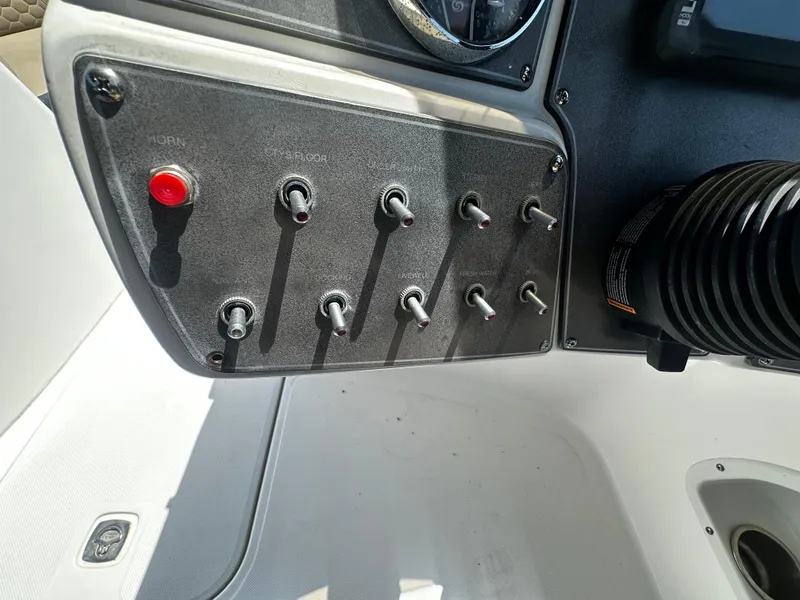 Slide: The Image of Control panel of 2021 Hurricane SunDeck Sport 192 RL OB boat with switches and gauges. - 7