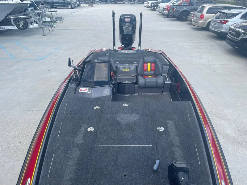 Slide: The Image of 2013 Bullet 21 XRS bass boat with seating and storage compartments. - 10