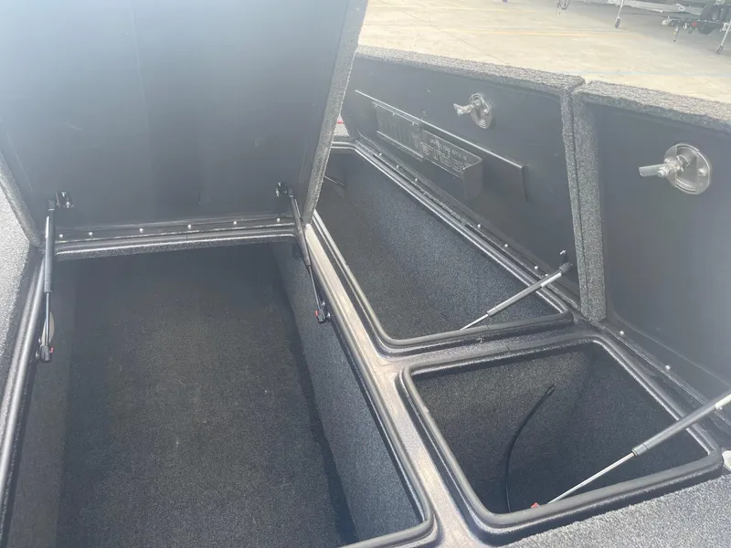 Slide: The Image of 2013 Bullet 21 XRS boat storage compartments open. - 13