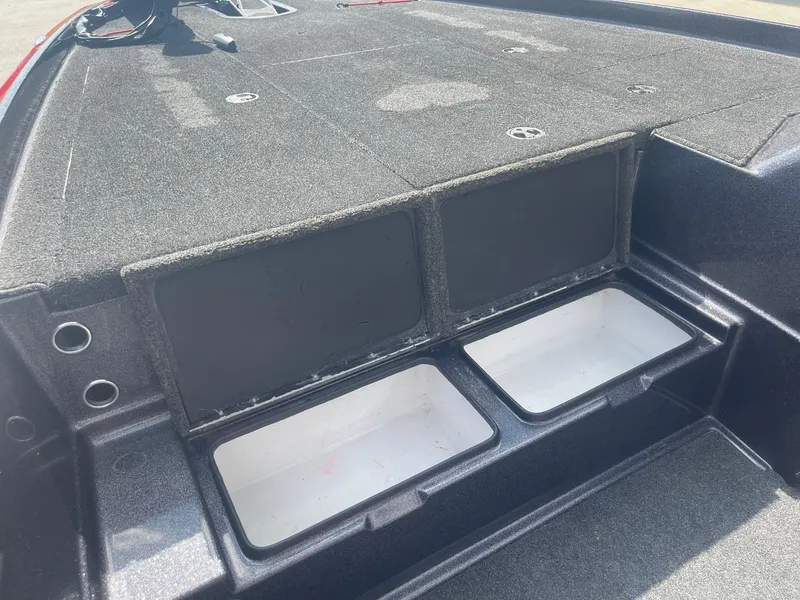 Slide: The Image of 2013 Bullet 21 XRS boat storage compartments and deck. - 16
