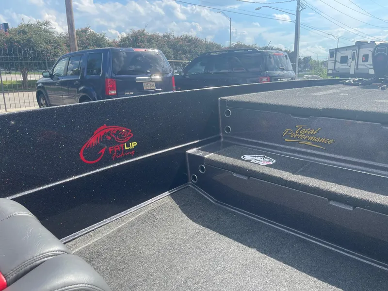 Slide: The Image of 2013 Bullet 21 XRS boat interior with FDL Lip and Total Performance logos. - 17