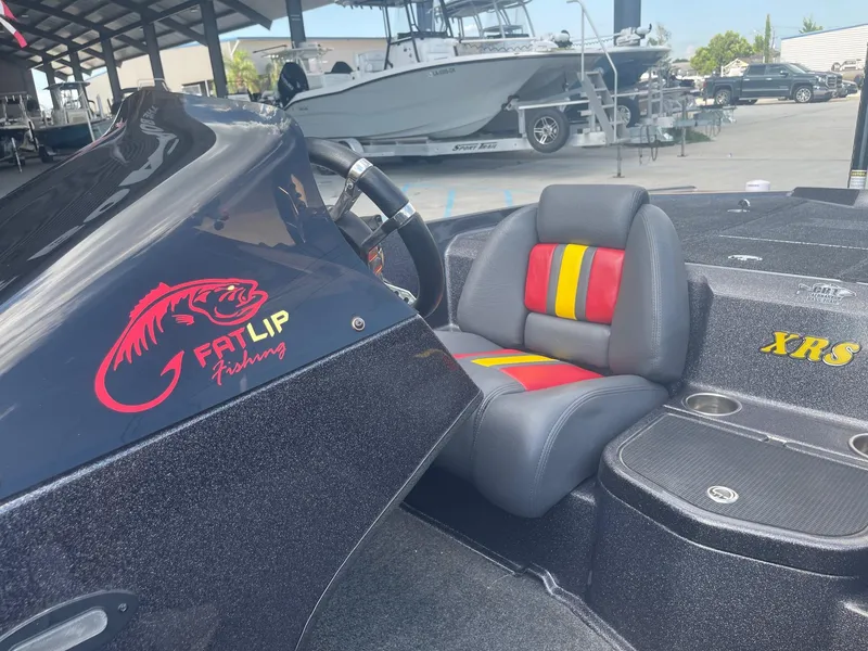Slide: The Image of 2013 Bullet 21 XRS boat with Fat Lip Fishing logo and colorful seat. - 18