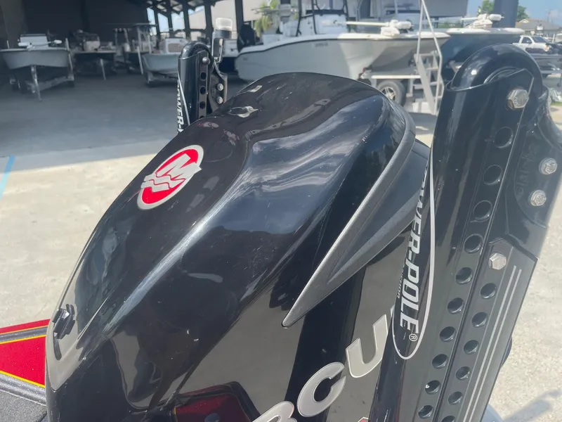 Slide: The Image of 2013 Bullet 21 XRS boat with Mercury engine and Power-Pole in a marina. - 24