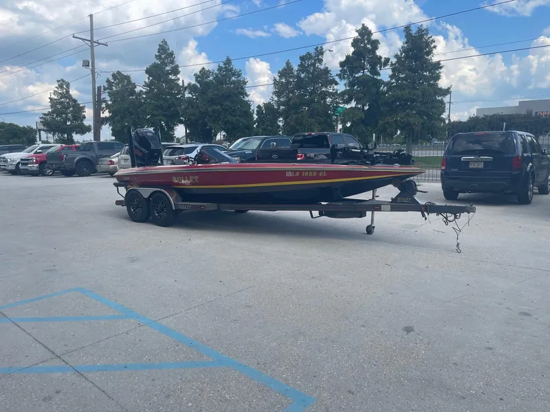 Slide: The Image of 2013 Bullet 21 XRS boat on a trailer in a parking lot. - 6