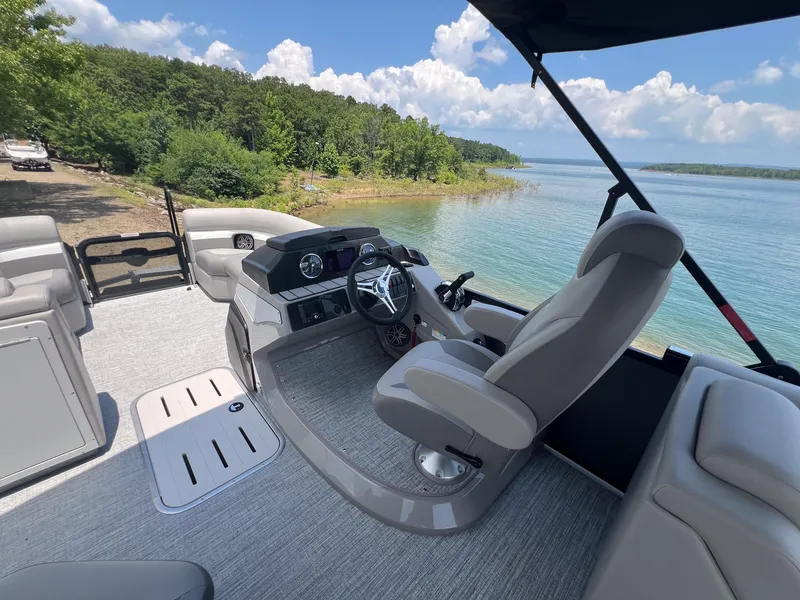 Slide: The Image of 2024 Premier 230 Sunsation RE pontoon boat interior with lake view. - 11