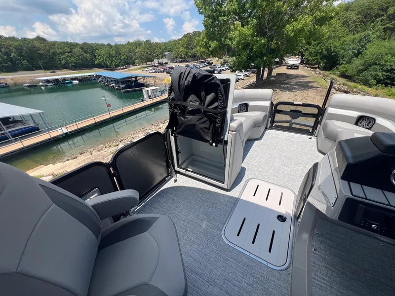 Slide: The Image of 2024 Premier 230 Sunsation RE pontoon boat interior with lake view. - 13