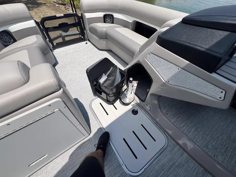 Slide: The Image of 2024 Premier 230 Sunsation RE boat interior with seating and storage. - 9