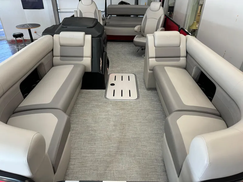 Slide: The Image of 2024 Premier 250 SunSation RL pontoon boat interior with plush seating and modern design. - 12