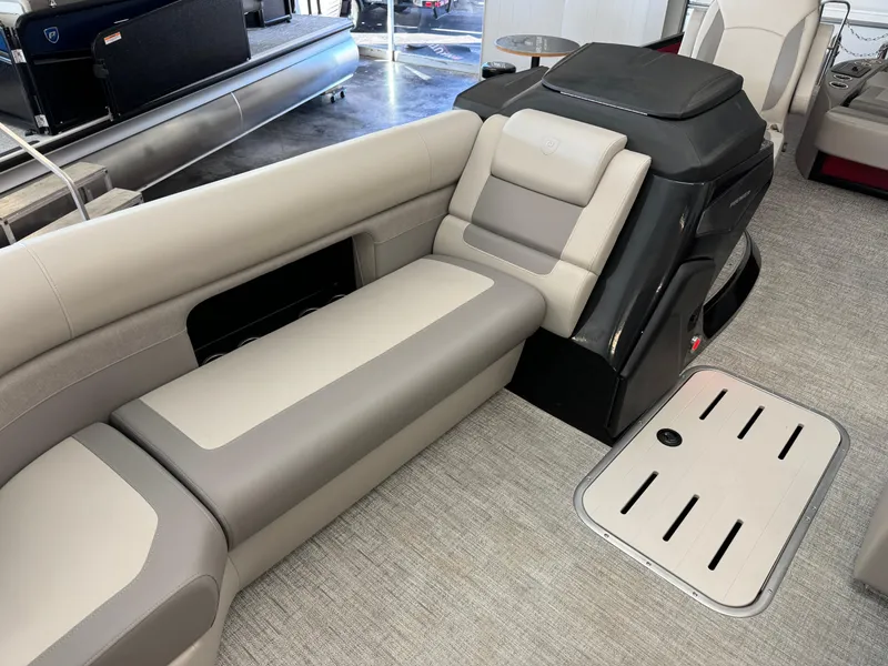Slide: The Image of 2024 Premier 250 SunSation RL pontoon boat interior with plush seating and modern design. - 13
