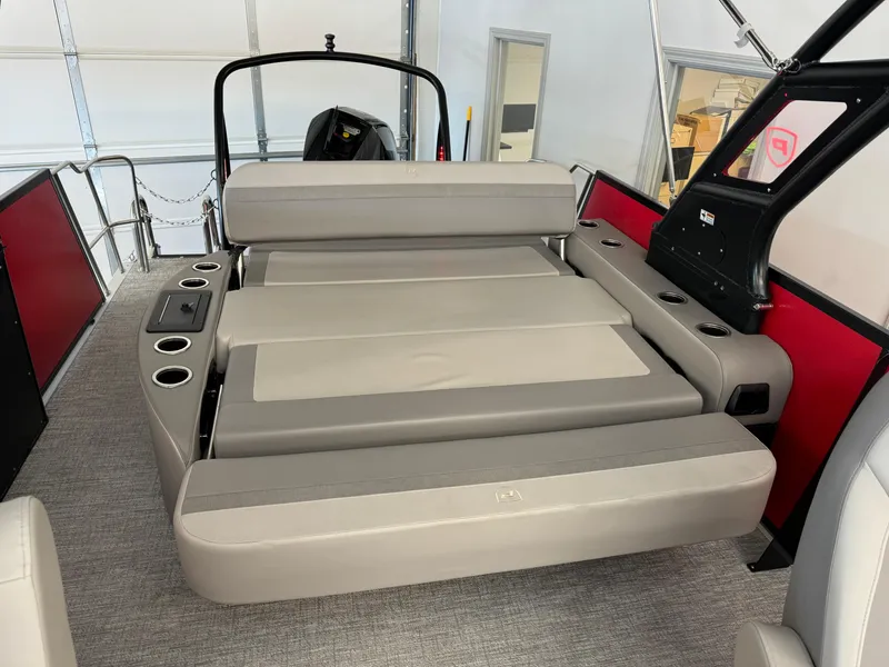 Slide: The Image of 2024 Premier 250 SunSation RL boat interior with spacious seating and cup holders. - 17