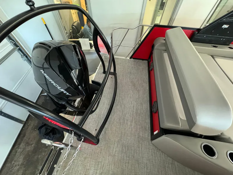 Slide: The Image of 2024 Premier 250 SunSation RL boat interior with Mercury engine and seating area. - 19