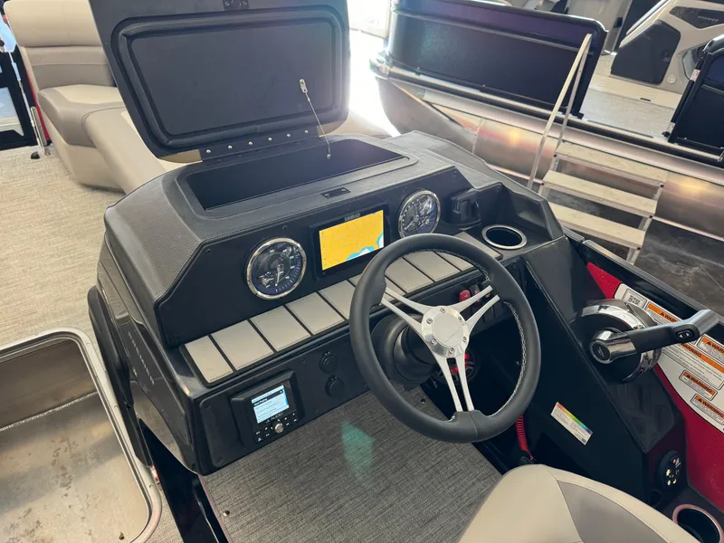 Slide: The Image of 2024 Premier 250 SunSation RL boat dashboard with steering wheel and gauges. - 20